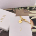 Gold-tone Dior pendant bracelet with a round charm and link chain
