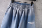 Light blue denim shorts with elastic waistband and side logo patch