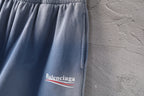 Light blue denim shorts with Balenciaga logo print on front leg