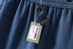 Light blue denim shorts with fabric tags hanging from waistband