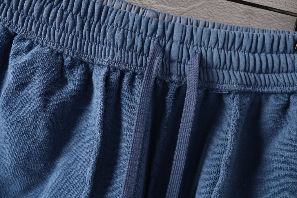 Light blue denim shorts with elastic waistband and gathered front detail