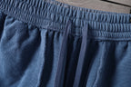 Light blue denim shorts with elastic waistband and gathered front detail