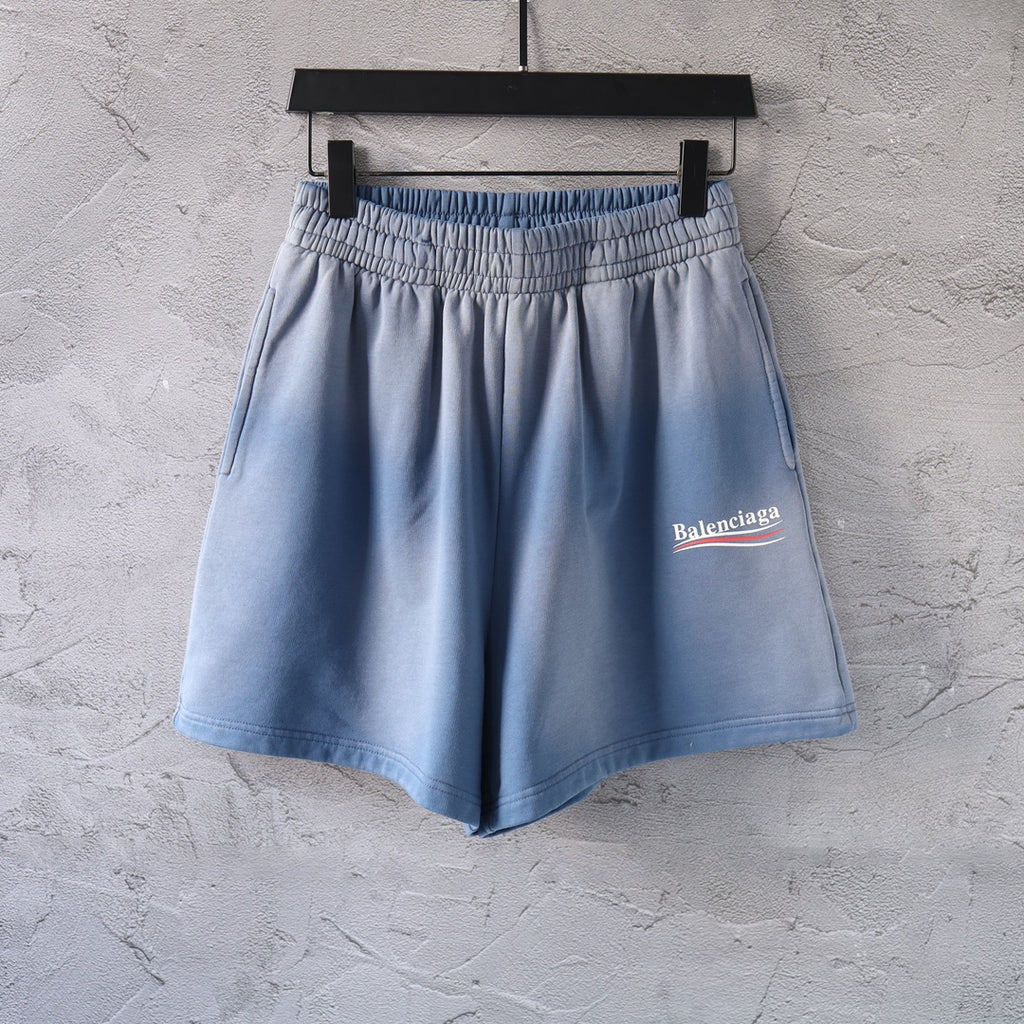 Light blue denim shorts with elastic waistband and side logo patch