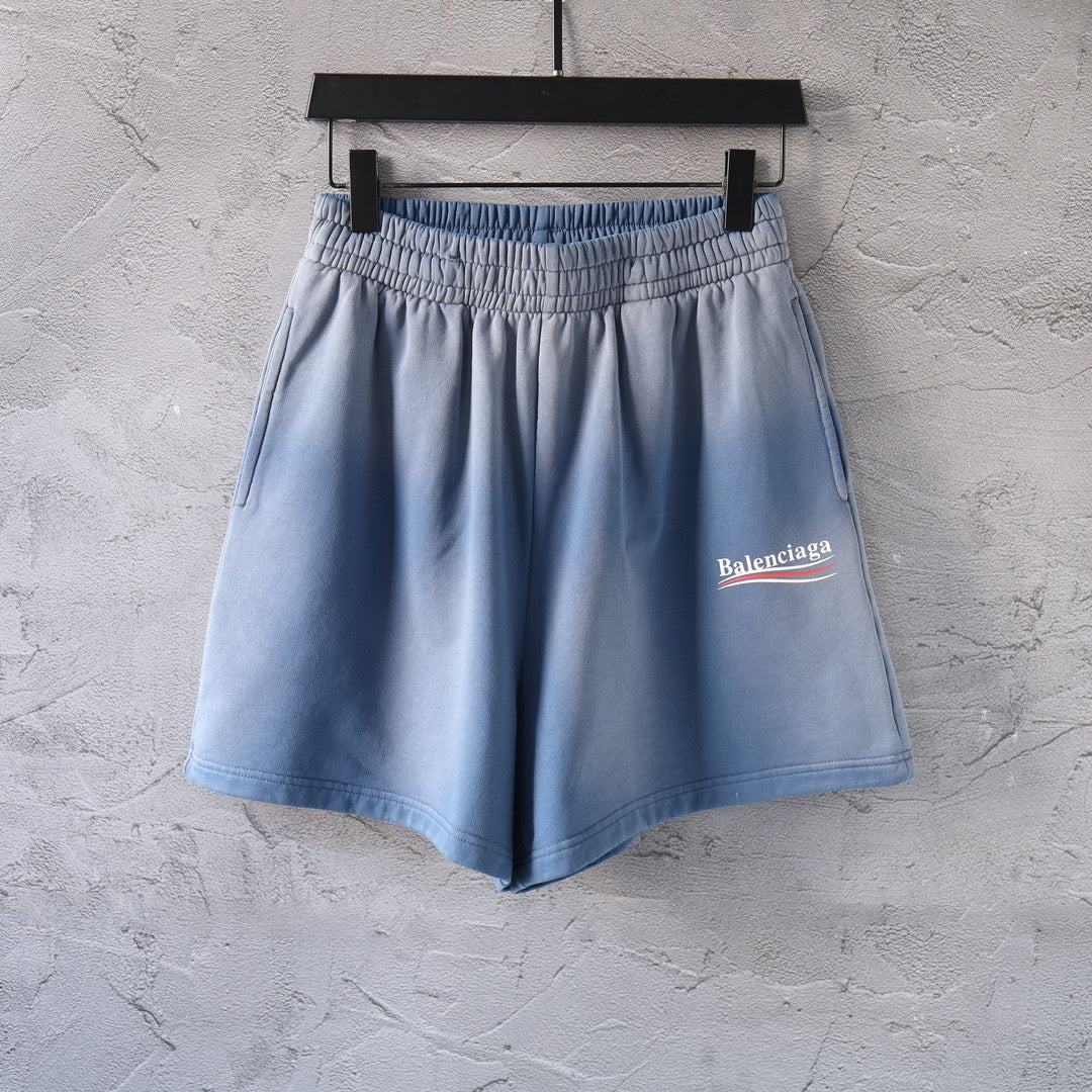 Light blue denim shorts with elastic waistband and side logo patch