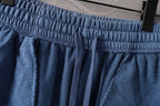 Blue elastic waistband pants with pleats and drawstring ties