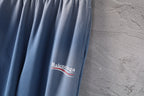 Light blue pants leg with Balenciaga logo patch