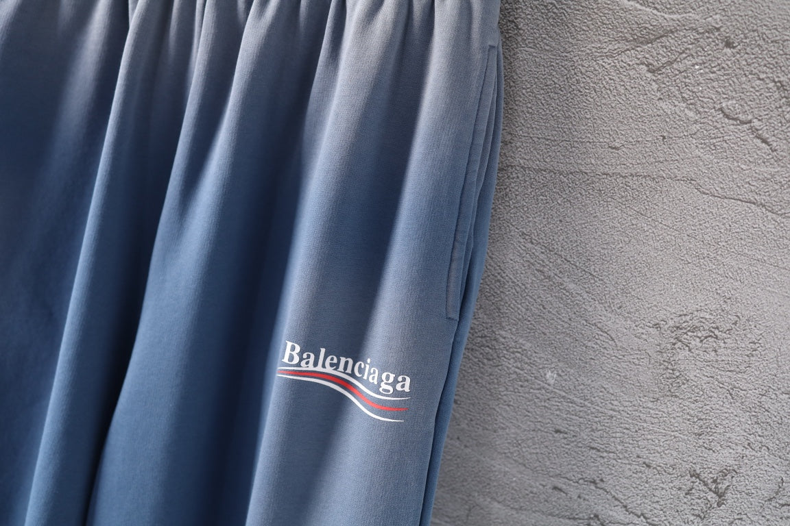 Light blue wide-leg pants with Balenciaga logo patch