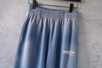 Light blue pants with elastic waistband and pleated front