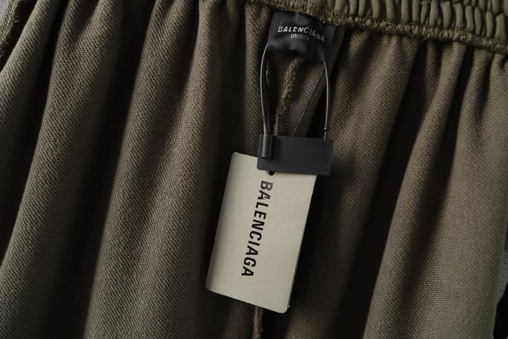 Olive green pants with Balenciaga size tag on inside waistband