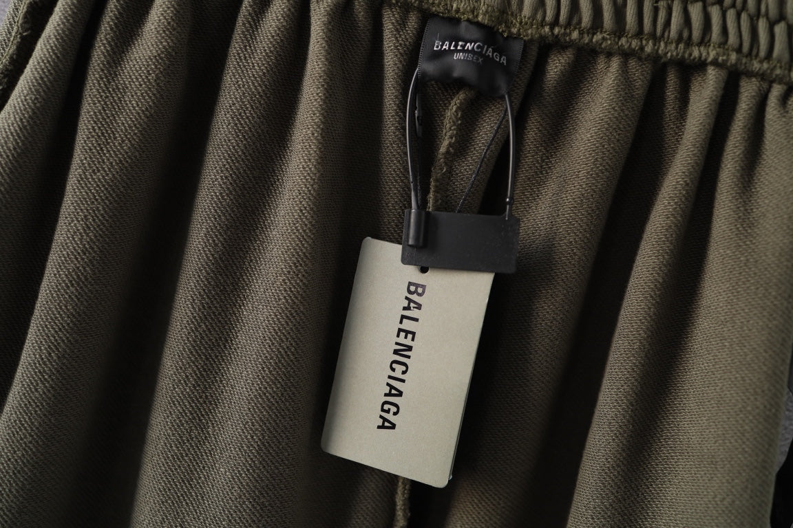Olive green pants with Balenciaga size tag on inside waistband