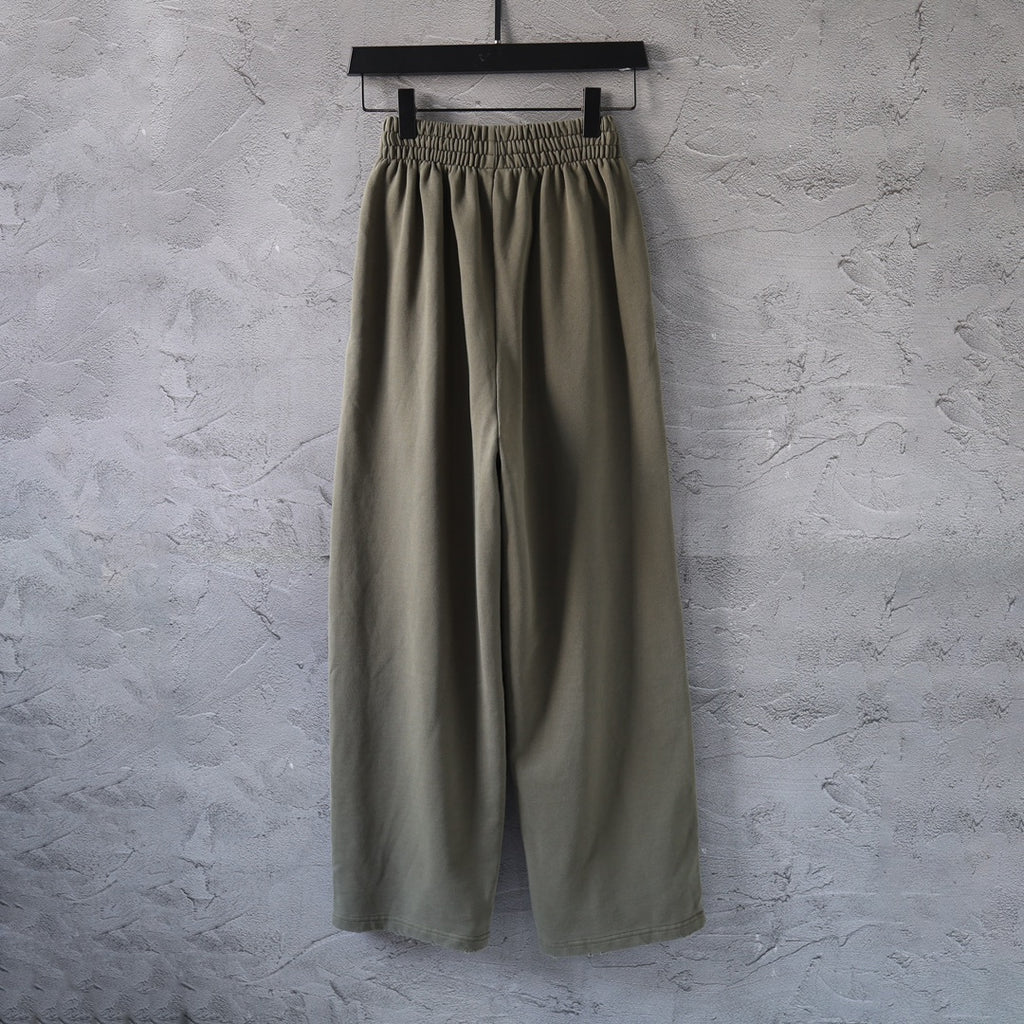 Olive green pants with elastic waistband and relaxed wide legs
