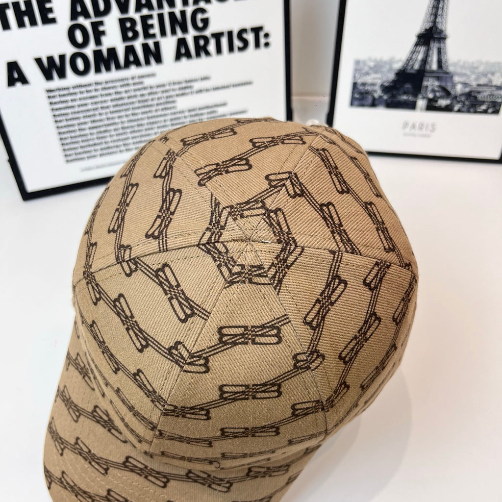 Tan baseball cap with dark chain-link pattern, top view of domed crown