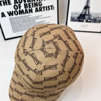 Beige baseball cap with dark chain-link pattern, slightly angled back view