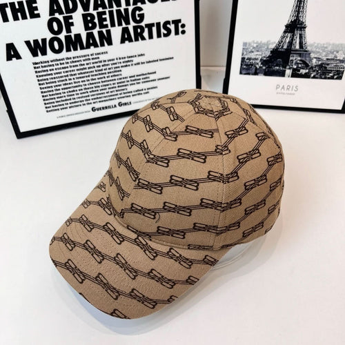 Tan baseball cap with dark allover chain-link pattern, curved brim, angled view
