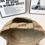 Beige baseball cap with dark chain-link pattern, open interior view of crown