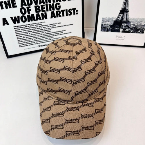 Tan baseball cap with dark chain-link pattern all over, curved brim, six-panel crown