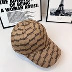 Tan baseball cap with dark chain-link pattern on six-panel crown and curved brim