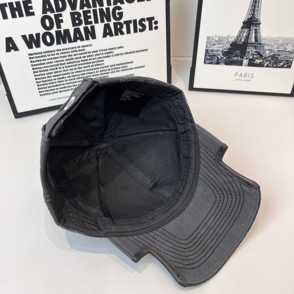 Burberry cap in dark gray/black with curved seam panels and inner lining tag