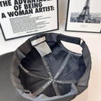Dior cap interior view with tag and repeating Dior Homme logo on the lining.