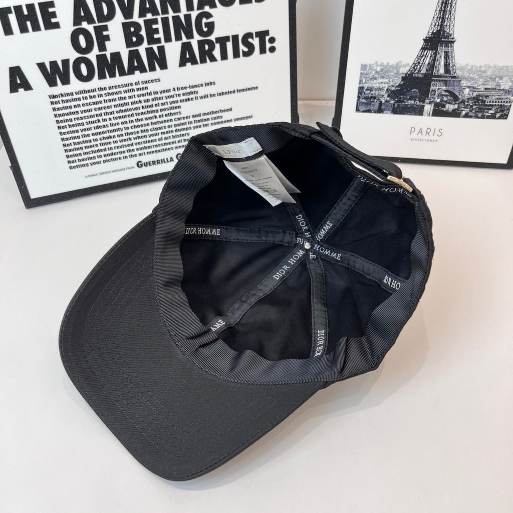 Dior black cap interior showing stitched panels and Dior Homme logo labels.
