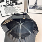 Dior cap interior with stitched panels and repeating Dior Homme logo trim.