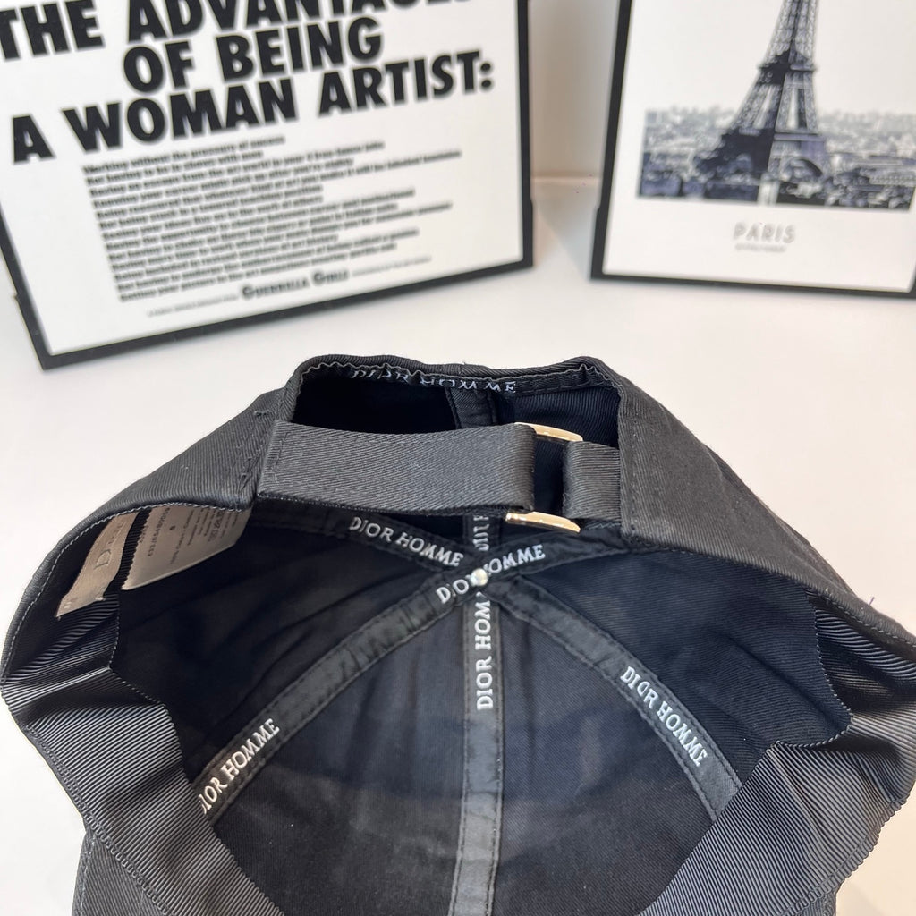 Black cap interior with Dior Homme printed straps and stitched lining.