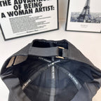 Black cap interior with Dior Homme printed straps and stitched lining.