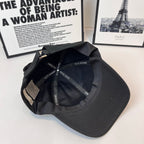 Dark cap interior showing Dior Homme printed lining and adjustable strap.