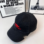 Black denim baseball cap with Balenciaga red logo patch on side