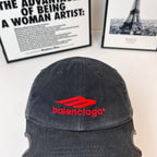 Black denim baseball cap with Balenciaga red logo near crown