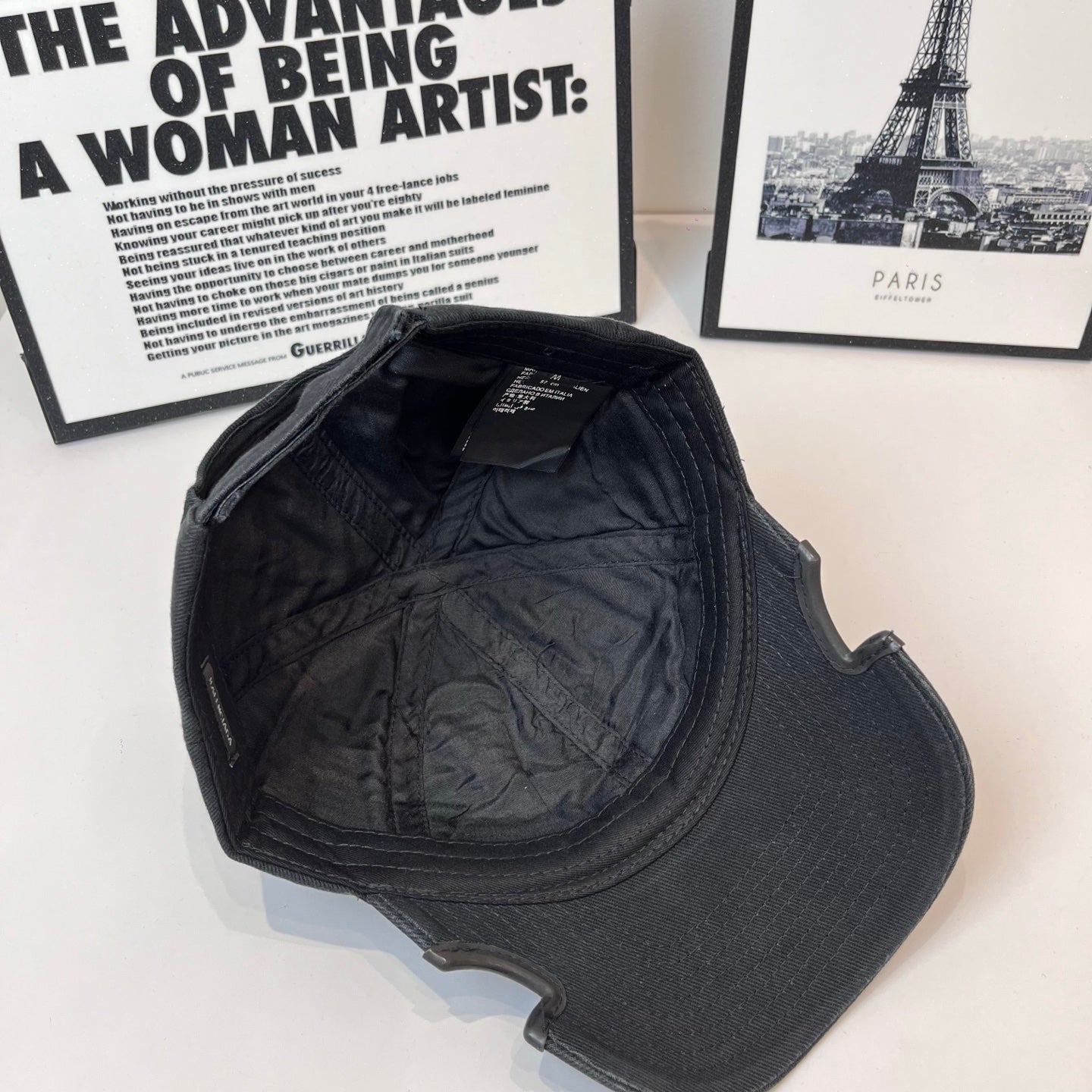 Black denim baseball cap interior view with quilted lining and strap area