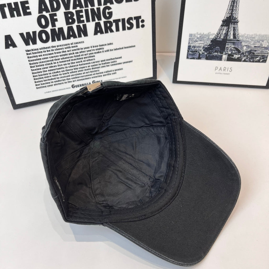 Dark baseball cap inner crown and curved brim, shown from inside view.