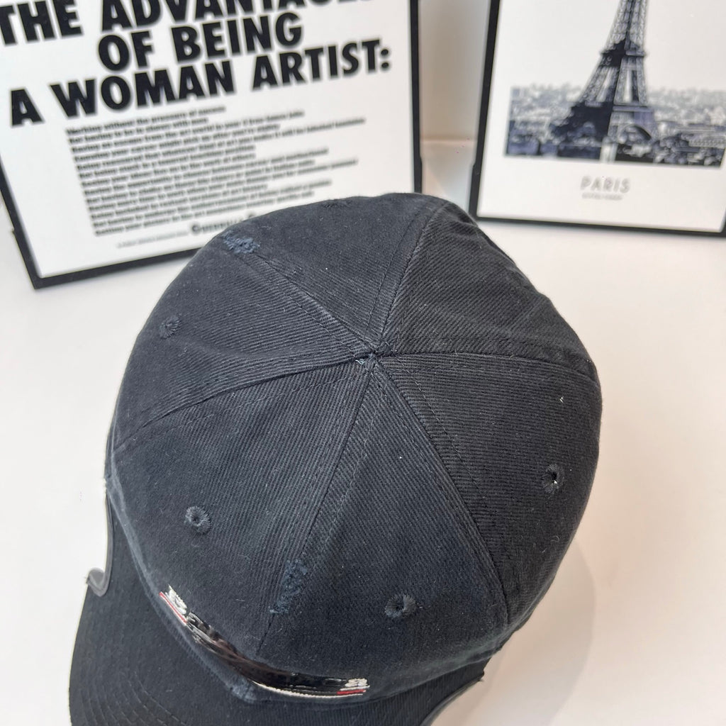 Balenciaga cap, dark fabric, back panel seams and small ventilation eyelets
