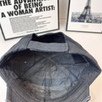 Balenciaga cap interior, dark stitched lining and curved brim edge