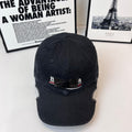 Navy baseball cap with front logo patch and embroidered eyelets on crown