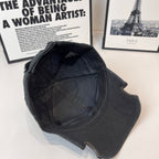 Black Balenciaga cap interior side view with quilted lining and stitched seams