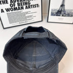 Black Balenciaga cap interior view with quilted lining and open brim