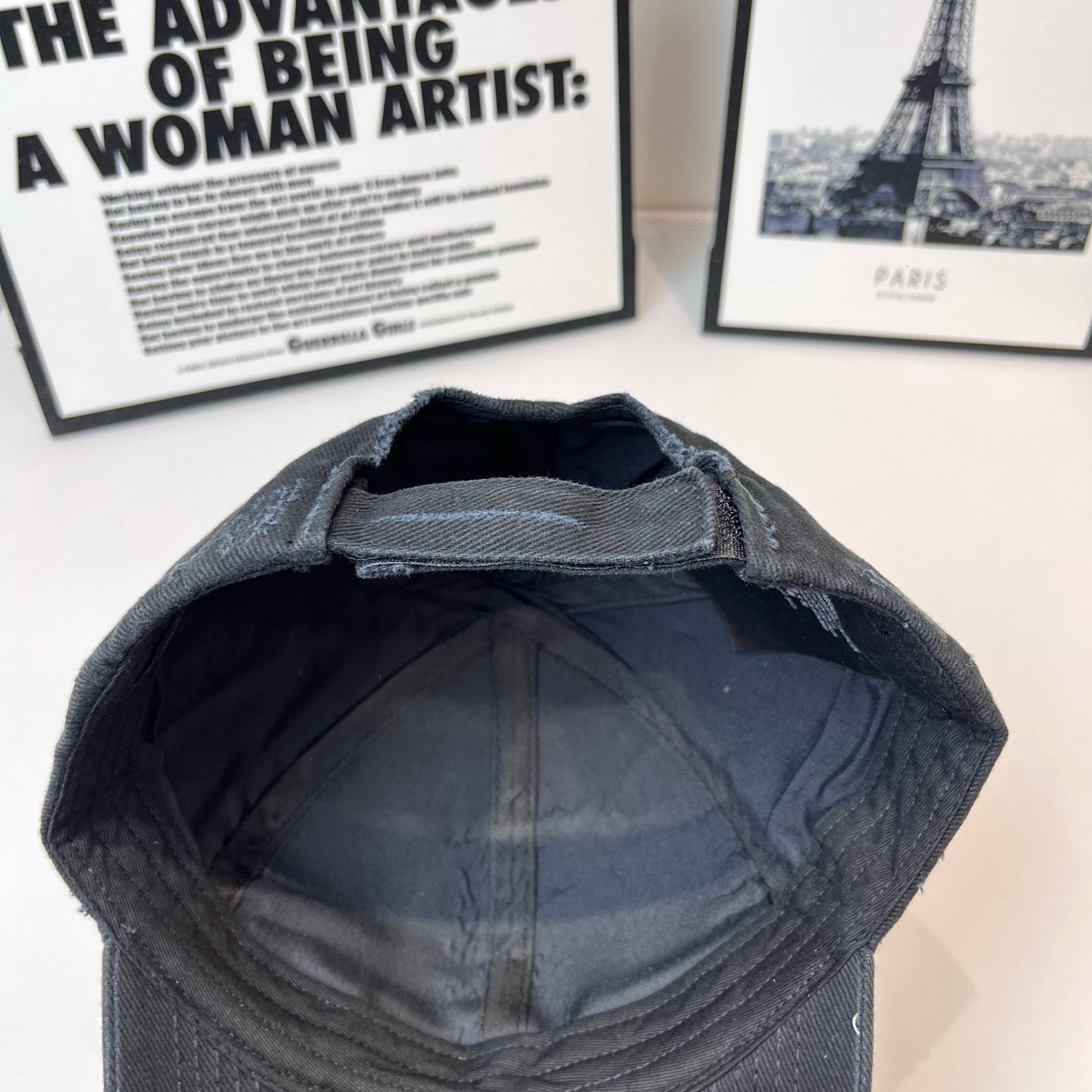Baseball cap interior view with dark lining and curved brim opening