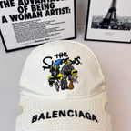 White Balenciaga cap with embroidered cartoon patch and BALENCIAGA logo on brim