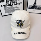 Burberry cap, white twill with embroidered cartoon graphic and bold BALENCIAGA text