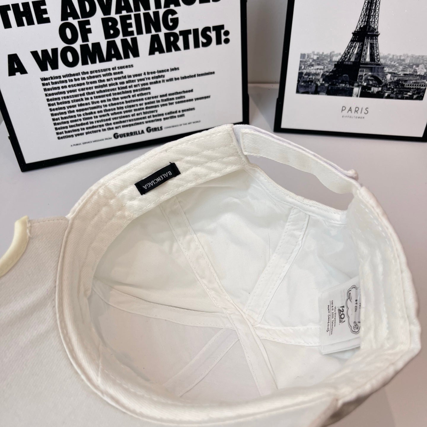 White Balenciaga bucket cap interior with fabric lining and small brand label