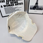 Burberry cap, interior view with white lining and stitched label at back