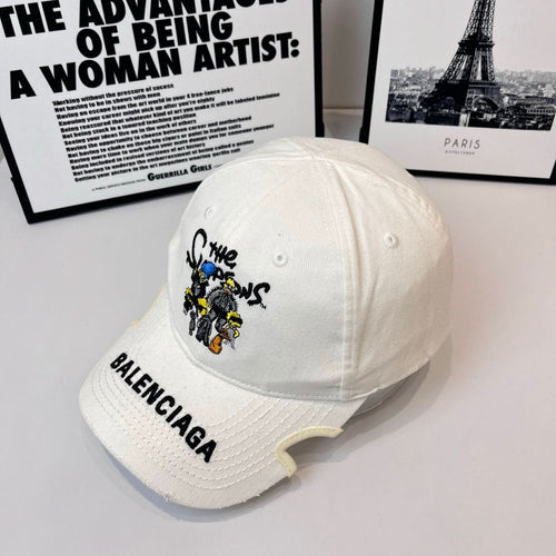 White Balenciaga cap, side view with embroidered cartoon patch and BALENCIAGA text