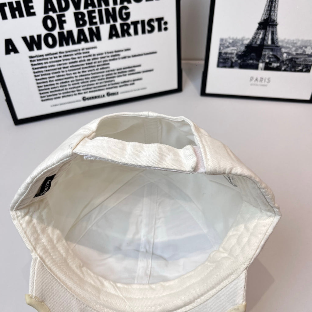 White Balenciaga bucket cap interior view with stitched panels and brim seam