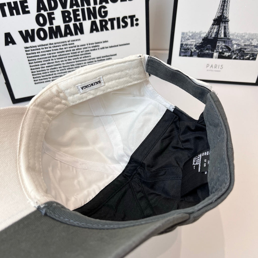 Two-tone baseball cap interior view with stitched brim and gray outer panel.