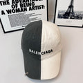 Two-tone baseball cap with BALENCIAGA logo, dark gray front and cream back.