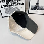 Two-tone cap interior view, black lining with off-white brim edge trim.