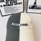 Two-tone baseball cap with BALENCIAGA logo, dark gray panel and cream panel.