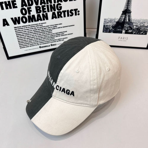 Two-tone baseball cap with BALENCIAGA logo, dark gray crown and off-white panel.