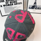 Baseball cap, dark gray with pink B pattern on side panel